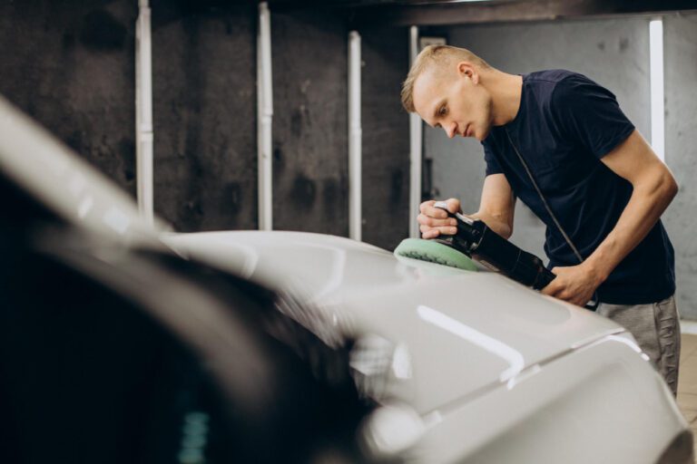 man-polishing-car-with-orbital-applicator-1-768x512